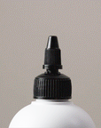 Gif showing the Violet Shampoo - Alcôve Hair coming out of the bottle