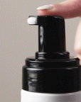 Gif showing a finger pressing on the nozzle of the Volumizing Mousse showing the texture of the product.