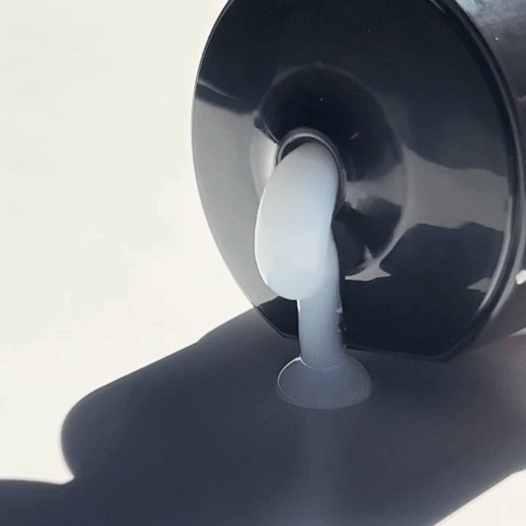 A GIF showing the texture of the Alcôve Hair Curl Activator coming out of the bottle.