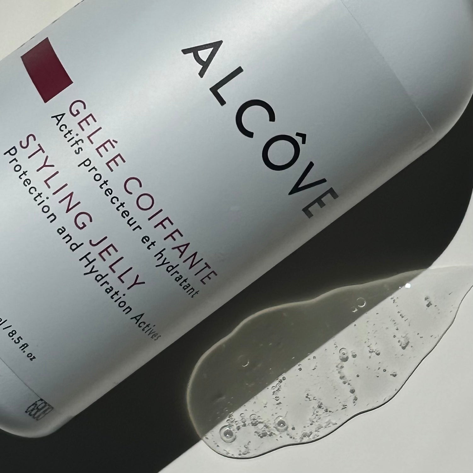 Close-up image of the Alcôve Hair Nourishing Styling Jelly for Hair bottle