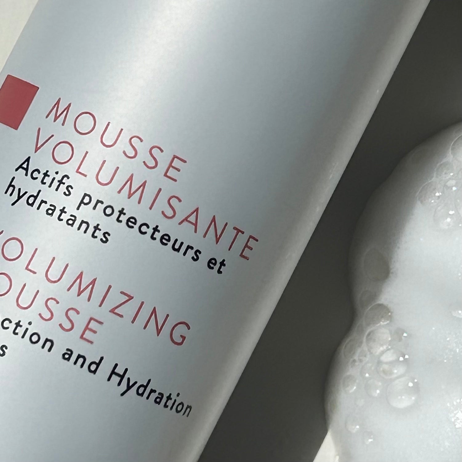 Close-up image of Volumizing Mousse Bottle by Alcôve Hair 200 ml
