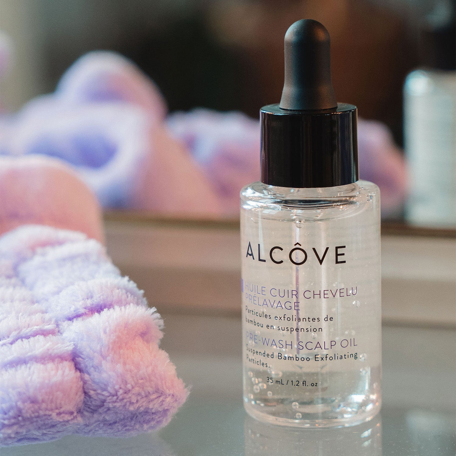 Bottle of Alcove Hair Pre-Wash Scalp Oil lifestyle